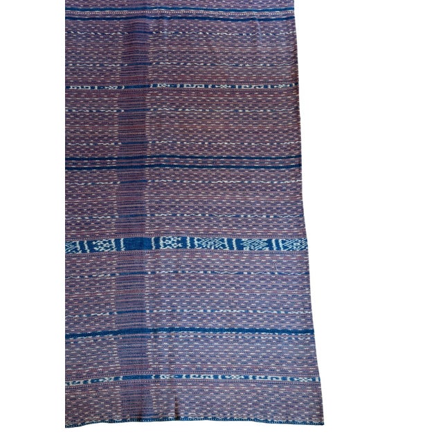 This handwoven ikat textile comes from Lembata Island, Indonesia, where it was traditionally crafted as a tubular waist...