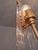 A rare and elegant 1970s chandelier, featuring five E27 sockets, clear glass rods, and beautifully renewed brass-coated...