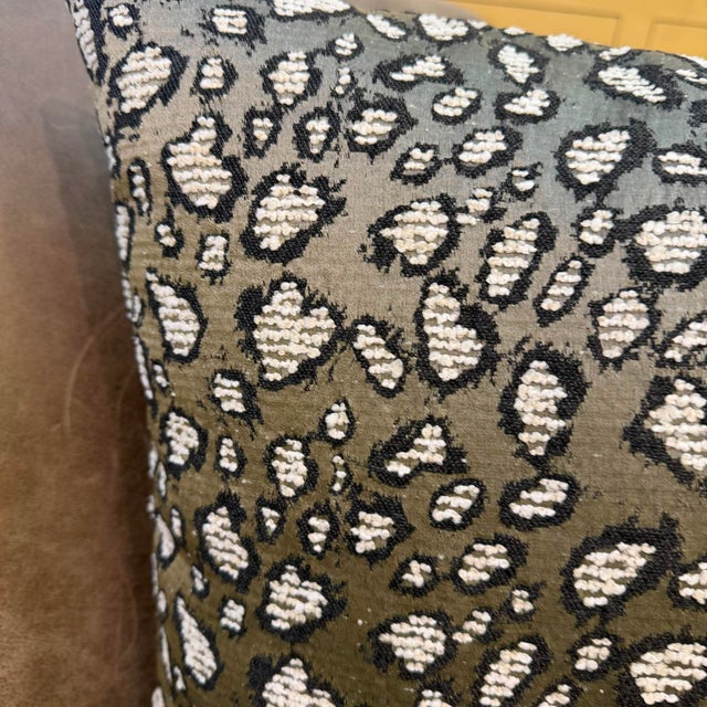 An abstract interpretation of a wild animal print constructed entirely through a complex jacquard weaving process....
