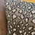 An abstract interpretation of a wild animal print constructed entirely through a complex jacquard weaving process....