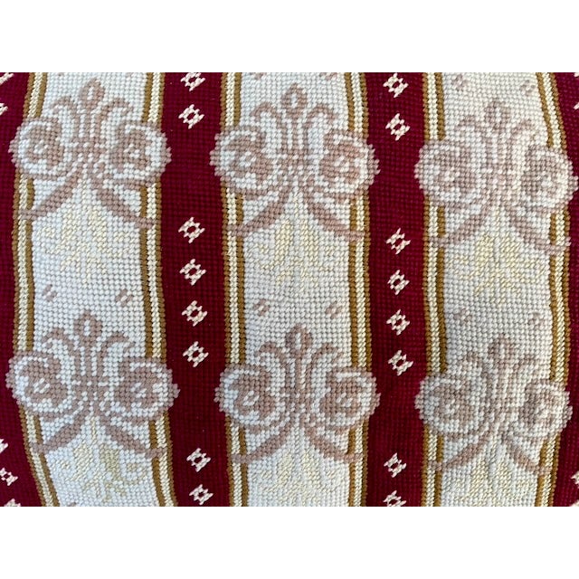 Lumbar pillow with a hand-stitched needlepoint front of vertical stripes with a damask motif, and velvet back....