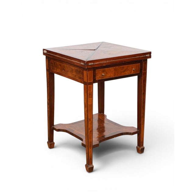 Exquisite 19th Century Victorian rosewood card or game table featuring an envelope style unwrapping to reveal a red...