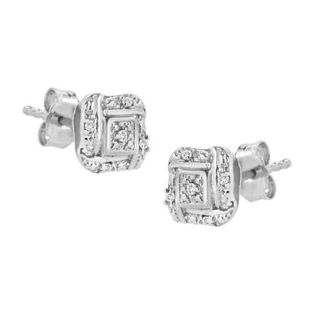 Simple yet classic, these beautiful diamond accent studs are crafted in genuine .925 sterling silver, plated with rhodium...