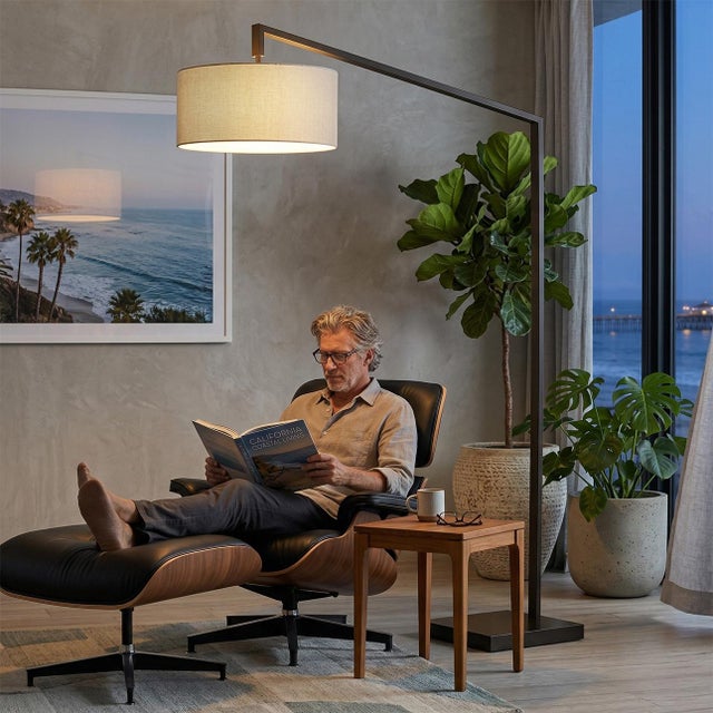 The Stretch 75" Arc Lamp is a modern arc lamp designed by Kirby Groce in 2011, featuring a sleek black steel arm and a...