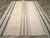 This mid-20th century Turkish Flatweave Kilim rug, embodies a refined minimalist aesthetic with its delicate interplay of...