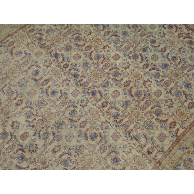 Herati Design Turkish Sivas rug with cinnamon and blue accents on a cream ground