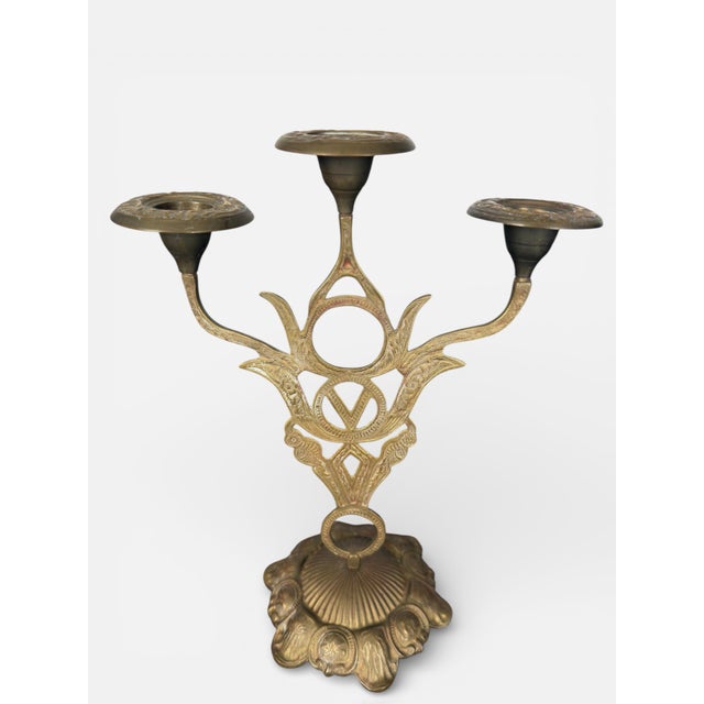 Elegant antique candlesticks dating to the late 19th–early 20th century, a period when Art Nouveau and Beaux-Arts...