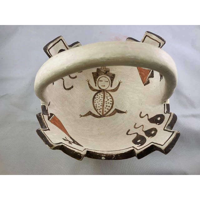 Rare Southwestern Prayer Bowl with Handle featuring traditional designs, signed by Jennie Laate (Zuni, 1933-1994)...