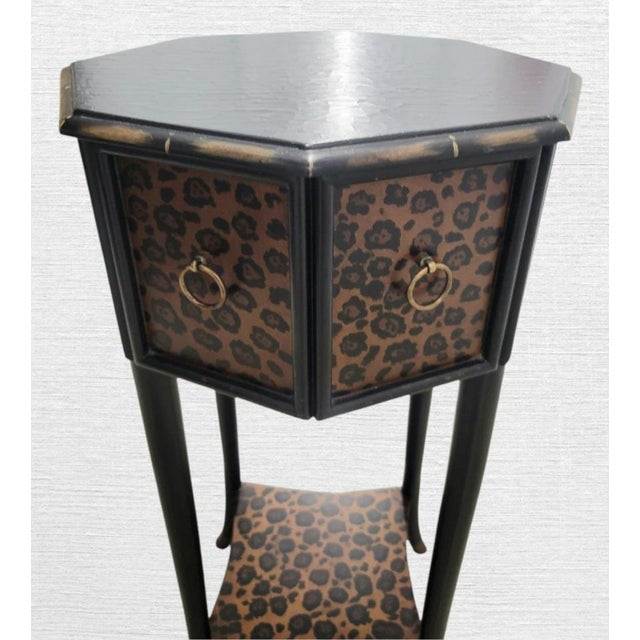 A fun a unique octagonal side table with leopard print design. The table features 1 pull out drawer with metal ring pulls....