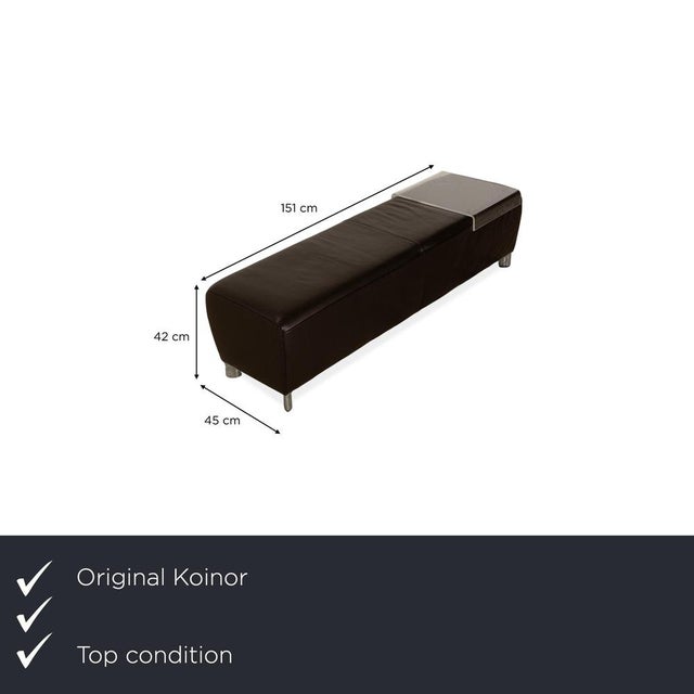 The Volare stool by Koinor is upholstered in brown leather and stands on a narrow, wraparound metal frame that ends in...