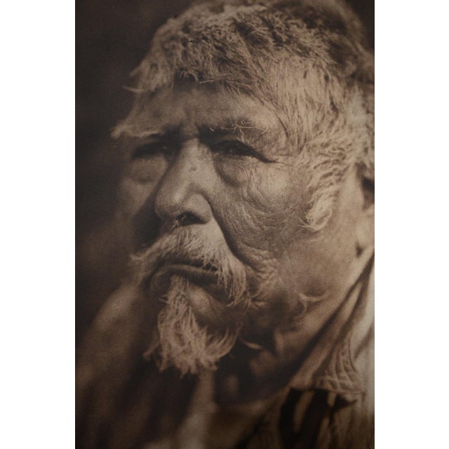 Among the most affecting portraits from the late volumes of The North American Indian, this large folio photogravure...