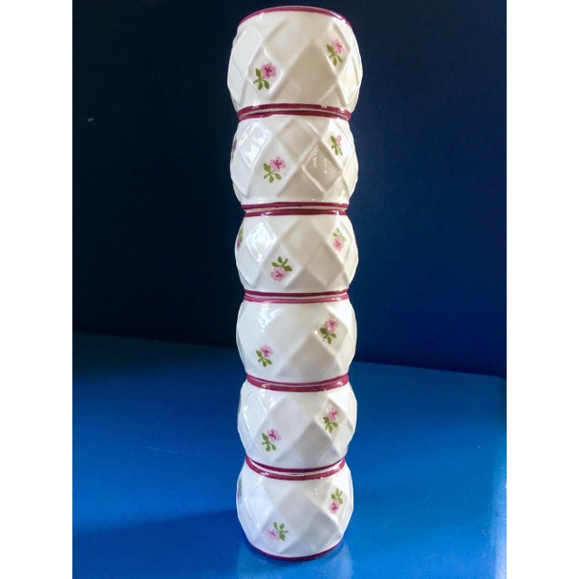 Pretty and classic bone China napkin rings by Pia. White lattice pattern, pink and greens flowers, with hand painted edging.