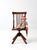 Antique Victorian children's swivel chair showcasing the remarkable craftsmanship and thoughtful design of its full-size...