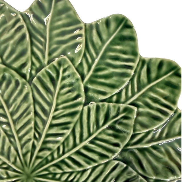 Portuguese majolica serving plate with a beautifully modeled design of overlapping lemon leaves radiating from the center....