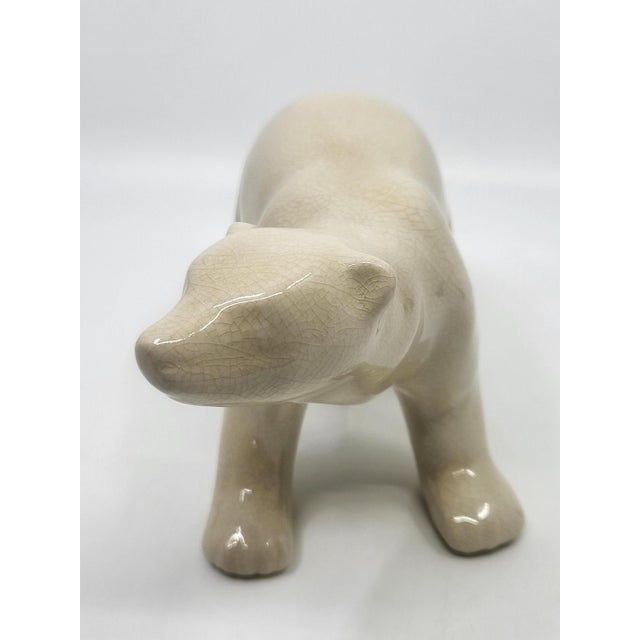 This crackle-glazed ceramic polar bear from the L&V Céram factory is a true example of the French Art Deco style of the...