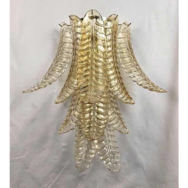 Pair of Mid Century Modern Murano glass sconces, in the style of Barovier Italy 1980s. The pair of large sconces is made...