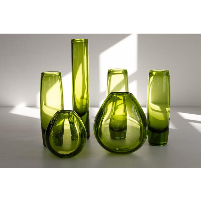 Very good original condition with only light patina consistent with age and use. The small drop vase has thin piece of...