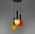 Beautiful coloured pendant lamp with red, green and yellow Murano glass shades. Each shade has a brass ring with a metal...