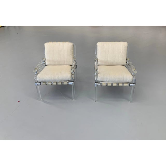 A nice pair of lucite and metal chairs by Jeff Messerschmidt. They are Pipeline 1000 chairs and numbered 37 and 38, 1973....
