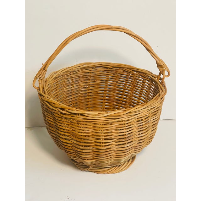 French vintage handmade market basket with a handle and raised bottom rim.