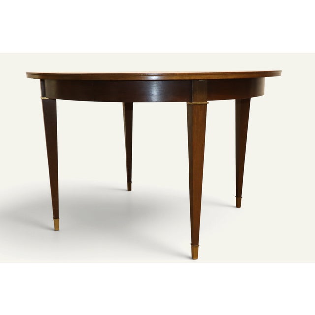 Charming extendable dining table in the neoclassical style, designed during the Art Deco period around 1940. Its elegant...