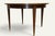 Charming extendable dining table in the neoclassical style, designed during the Art Deco period around 1940. Its elegant...