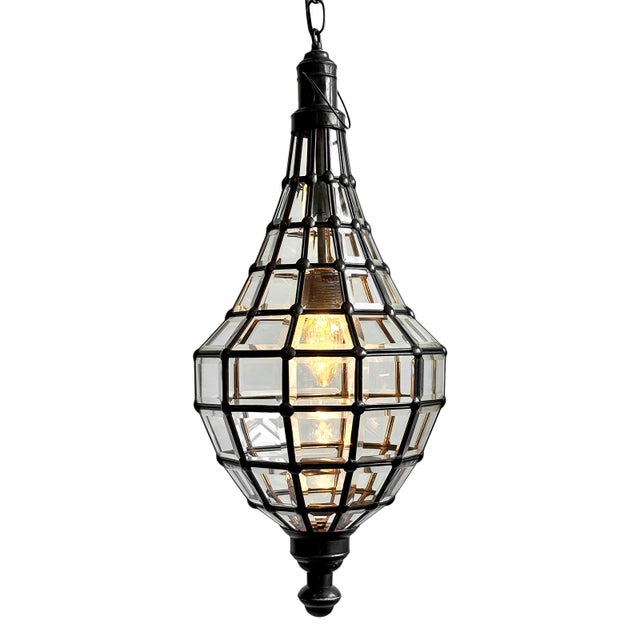 Beautiful hand crafted beveled glass and dark bronze finish raindrop design pendant lantern. Includes 3' black hanging...