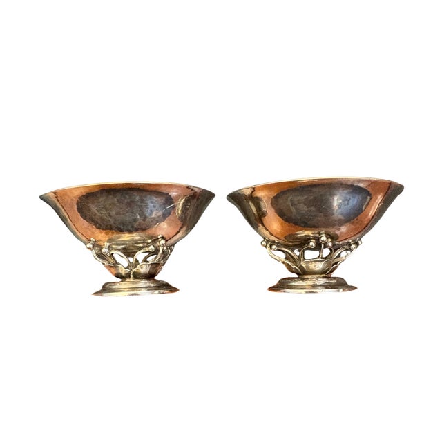 An exceptional rare pair of Georg Jensen sterling silver salts, model 235D, each rising on an organic tendril base to a...