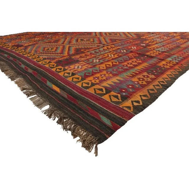 Vintage Afghan Ghalmouri Maimana Kilim Rug with Nomadic Tribal Style. Boasting a stunning tribal design and modern style,...