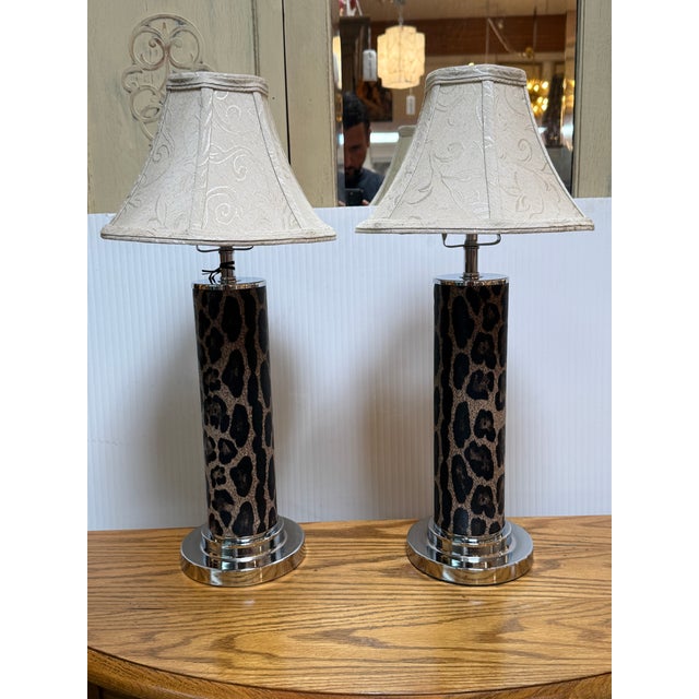 Design Plus Gallery presents a Pair of Leopard Print Table Lamps. The lamps have a cylindrical form with. great animal...