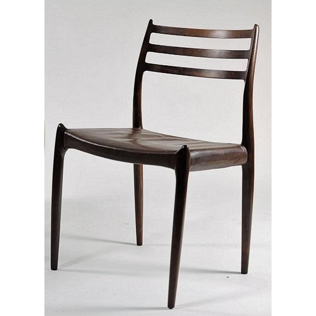 The iconic model 78 dining chair was designed in 1954 by Niels O. Møller for J.L. Møllers Møbelfabrik. The model is with...