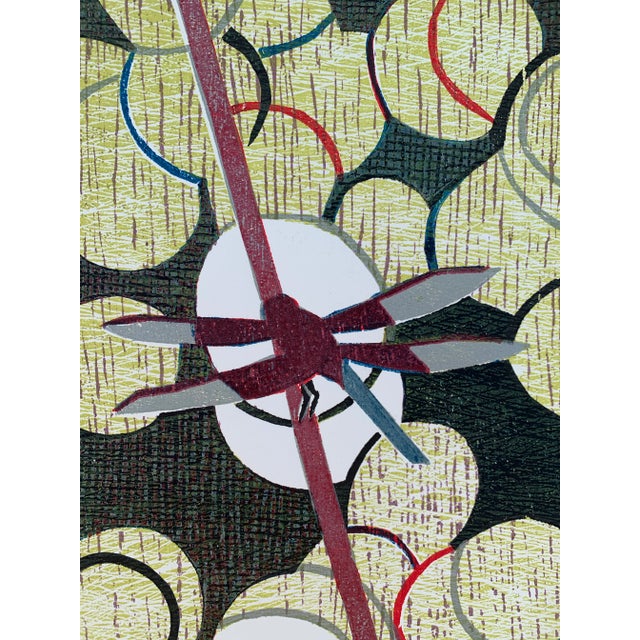 Woodcut print by Brazilian artist Hannah Brandt (1923-2020). This piece is not titled. Depicts a dragon fly over lilly...