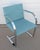 Brno style chair (designed by Ludwig Mies van der Rohe) with flat metal arm and fabric. The chair is not marked and from...