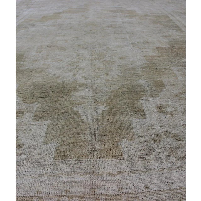 Medallion Design Vintage Oushak Rug in Muted Tones of Faded Yellow and Neutrals For Sale - Image 4 of 12