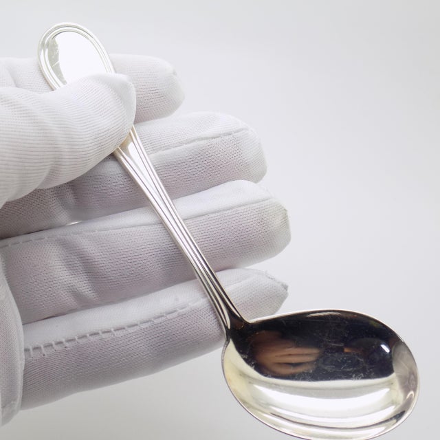 Enhance your dining experience with this exquisite vintage Italian handmade silver engraved feeding spoon. Dating back to...