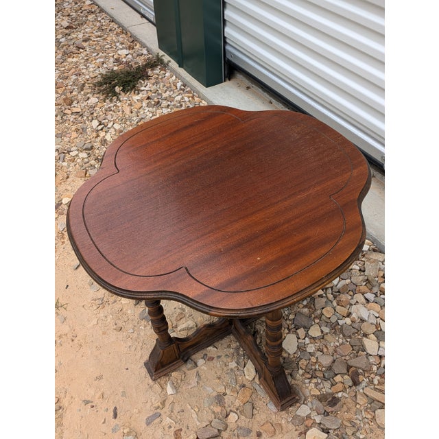 Small four leaf clover oak end /side table is sturdy with few imperfections. This table would go in several different rooms.