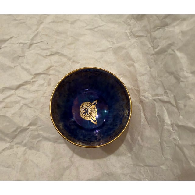 Fabulous gilded, a 'strange large eared creature' decorates the interior of this miniature bowl by Daisy Makeig-Jones for...