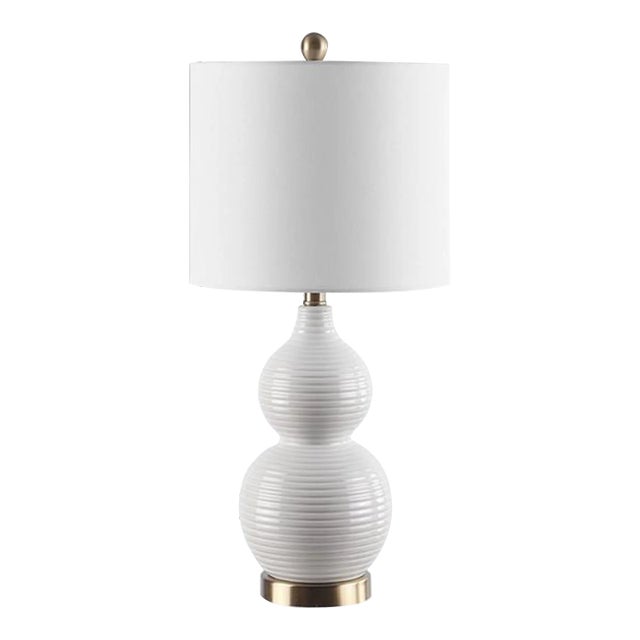 Refresh room decor with the utterly striking Emery Table Lamp. Flaunting a a striated double gourd silhouette in rich...