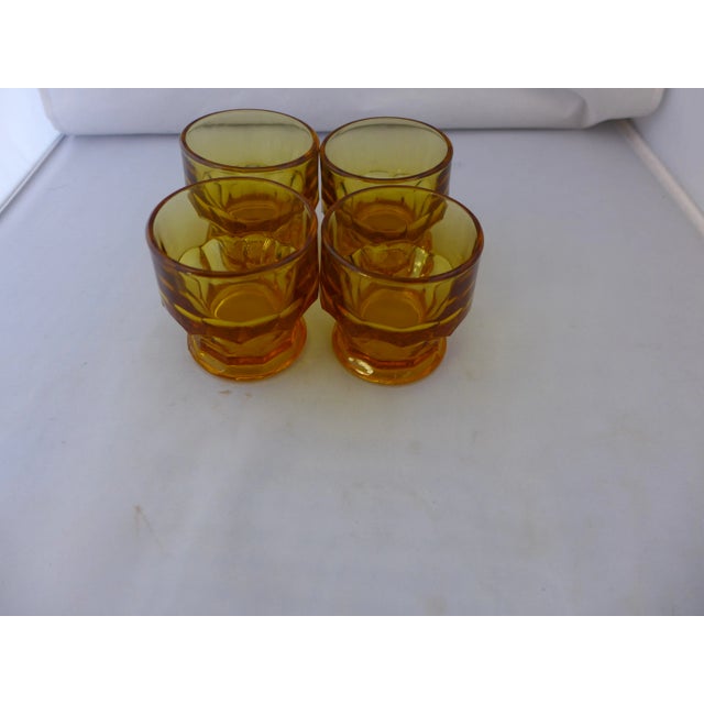 Mid-Century Modern set of four glass. These feature a honeycomb amber hue. Perfect juice or cocktail glasses. 2.85'D X 3"H...