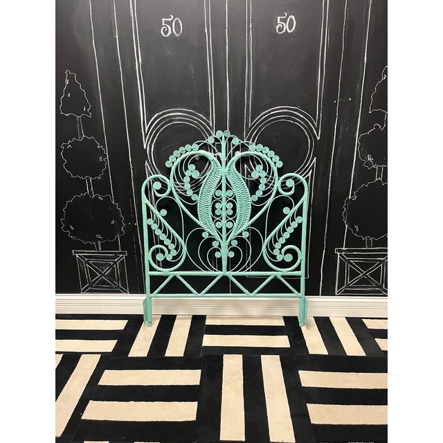 This beautifully restored vintage peacock headboard is crafted from hand-woven rattan and showcases the iconic fan...