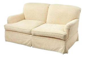 Fully Upholstered and Skirted Cream Loveseat