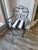 Add timeless style and European elegance to your space with this vintage masterfully crafted hand-wrought iron scroll-arm...