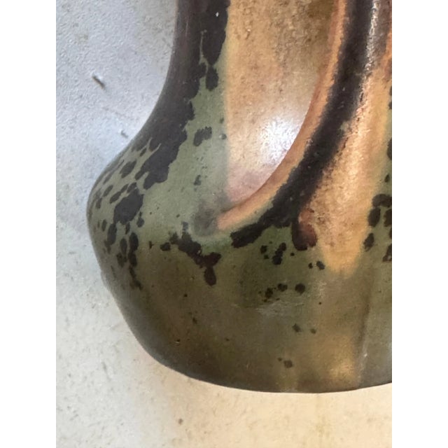Vase in Sandstone, in a brown and Green color with iris inside. with a beautiful Glaze. It has been made in France circa...
