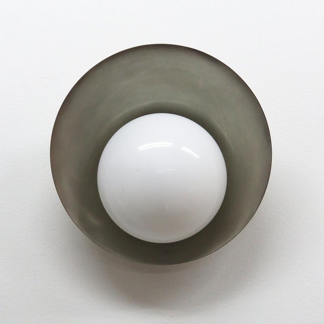 Wonderful wall lights by Gallery L7, handcrafted and finished in Los Angeles from American brass, with an opaline glass...