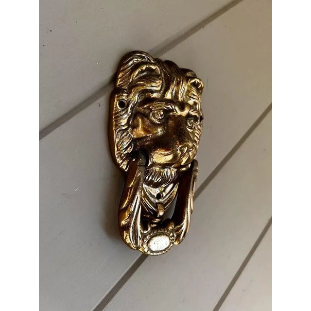 Beautiful Lion's head knockers with knocker plate in solid brass. Mounting screws not included.