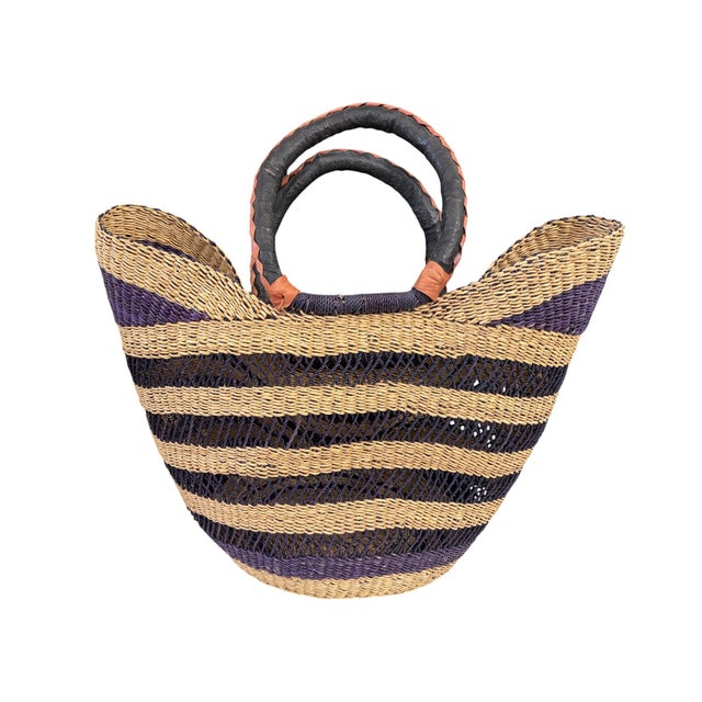 This African Bolga Basket from the Bolgatanga region of Ghana, inspired by Saint-Tropez French Riveria town, is of...