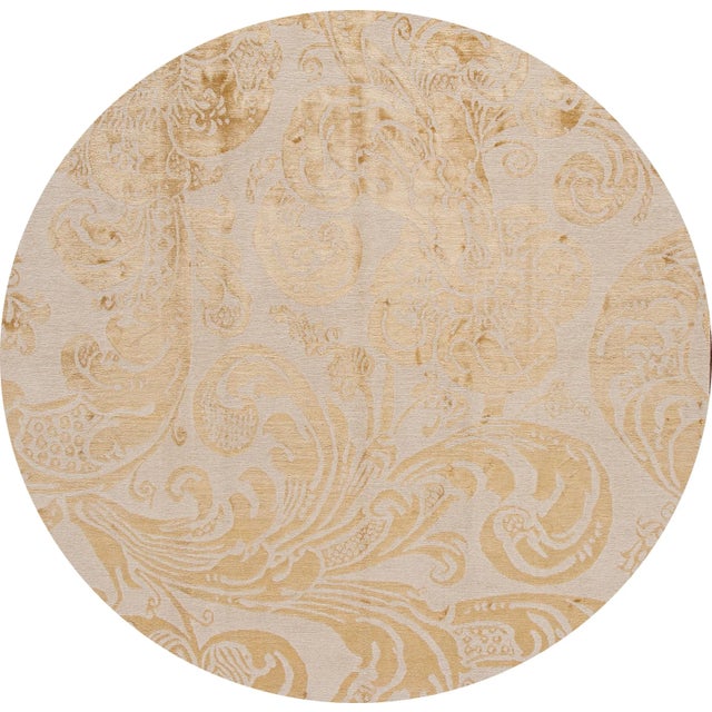 This Contemporary Tibetan wool and silk Rug has a beige field and gold accents on an abstract motif. This rug measures 8 '...