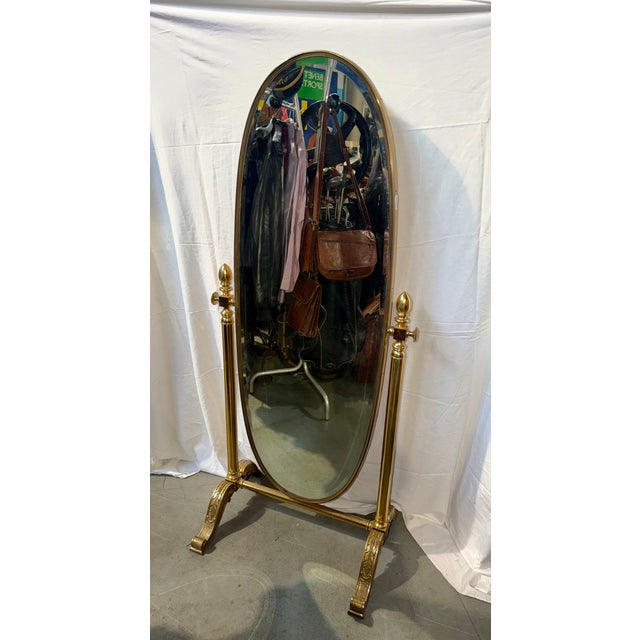 Antique gilded bronze pedestal mirror from the 1950s with cut glass. An excellent decorative piece.