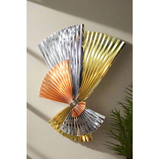 Jere Wall Sculpture has a unique pinwheel or fan design with three metals including copper, chrome, and brass. Colorful,...