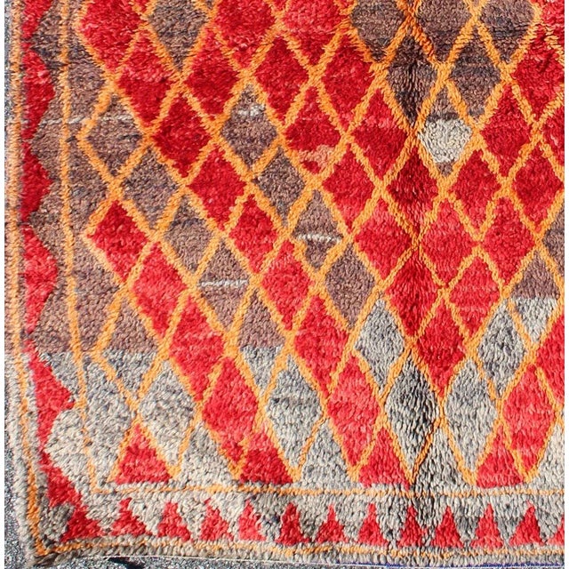 Midcentury Moroccan rug with orange, red, brown diamonds and blue fringe detail. Keivan Woven Arts / rug sk-628, country...